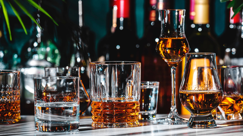 Various brown cockails in glasses