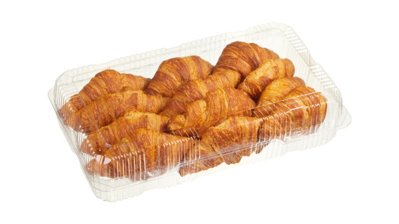 A beauty shot of a 12-count pack of Kirkland Signature Butter Croissants on a white background
