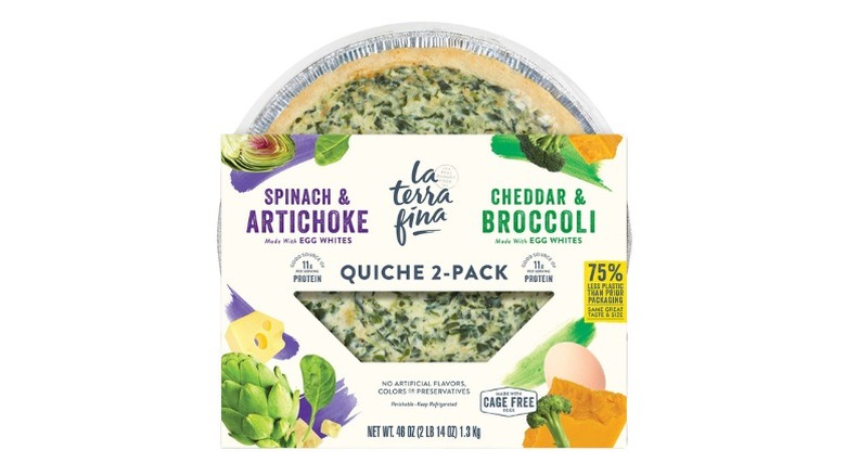 A beauty shot of a 2-pack of La Terra Fina Quiche, spinach & artichoke and cheddar & broccoli, in packaging and pans on a white background