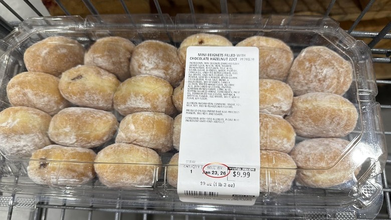 A package of Mini Beignet Filled with Chocolate Hazelnut in a shopping cart at Costco