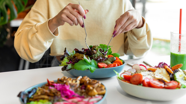 person making healthy lunches