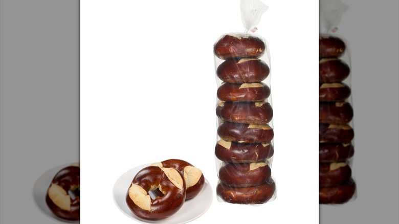 Package of Pretzel Bagels next to two bagels on a plate