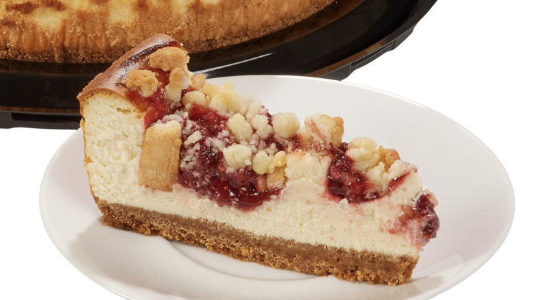 Slice of Strawberry Streusel Cheesecake on a plate