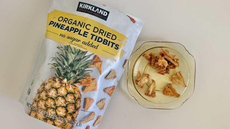 Glob of pineapple on a plate as well as smaller pieces