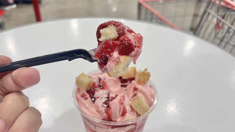 Eating ﻿strawberry shortcake sundae with a spoon
