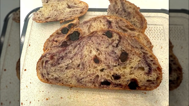 Slices of Costco Blueberry Sourdough Bread on cutting board