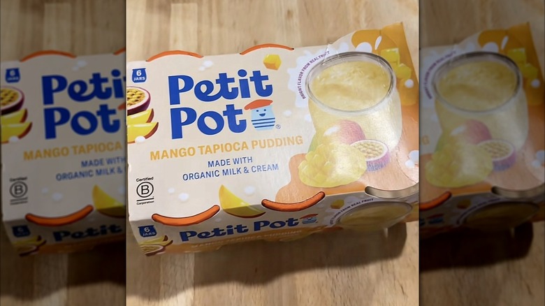 Petit Pot Mango Tapioca Pudding on wood surface