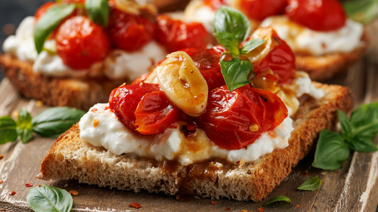 Close up of cottage cheese pizza toast with various toppings.