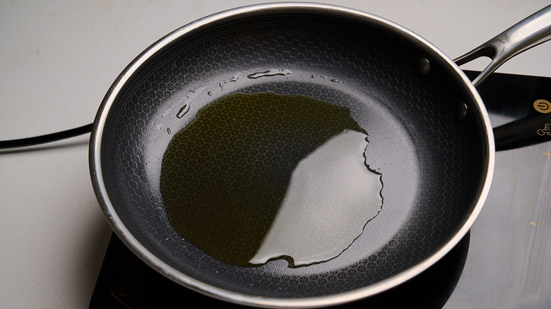 heating oil in a skillet