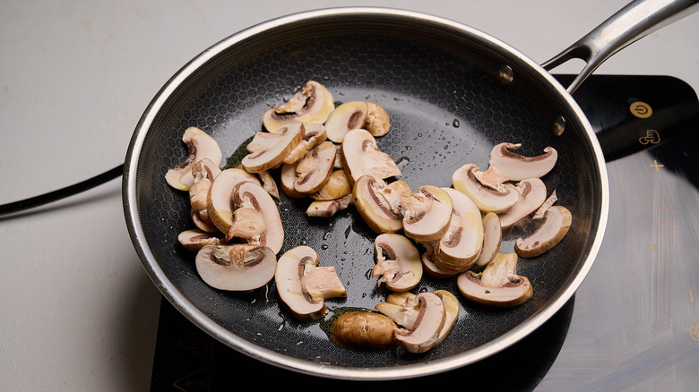 cooking mushrooms in a skillet
