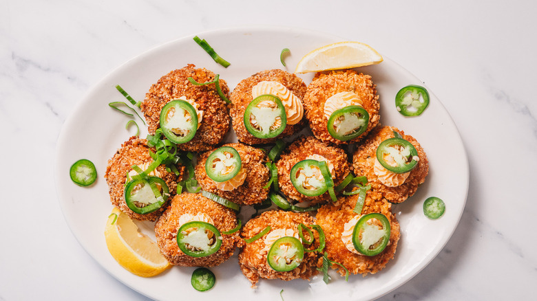 crab cake jalapeño popper bites on a white platter