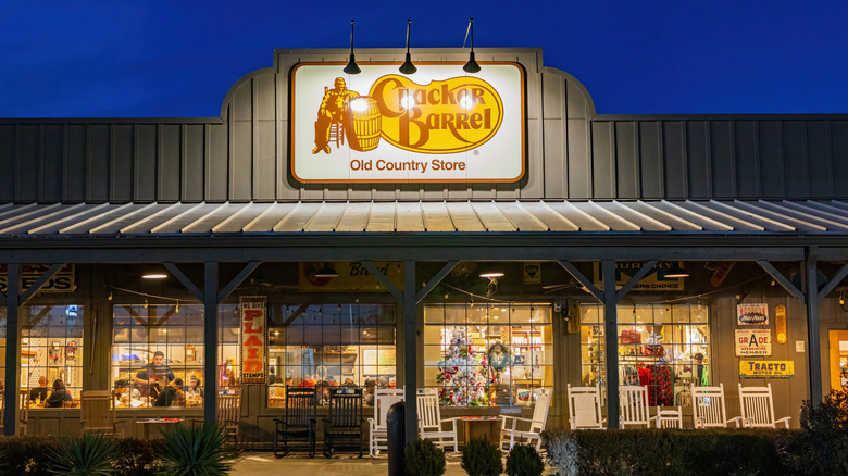 A cracker barrel storefront porch at night