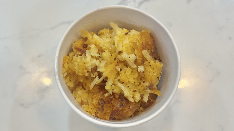 Cracker Barrel hashbrown casserole in a to-go container