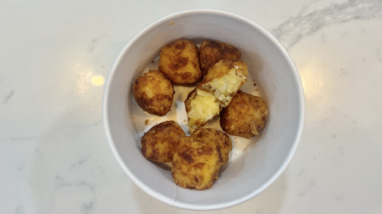 Cracker Barrel hashbrown casserole tots in a to-go container