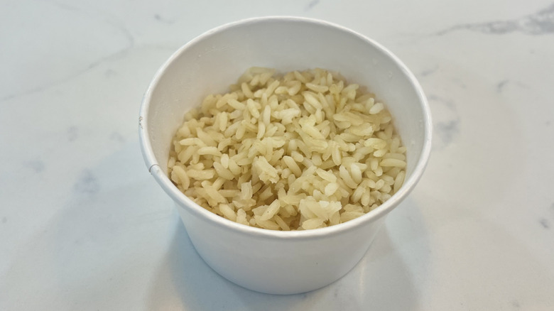 Cracker Barrel seasoned rice in a to-go cup
