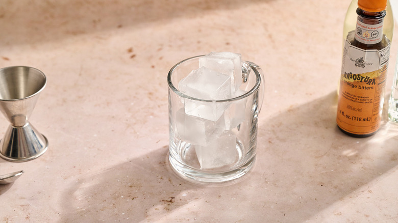 glass filled with ice on a table