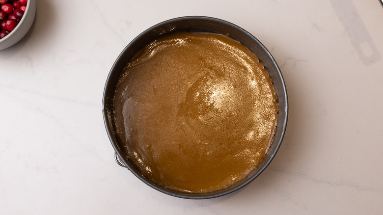 cake tin with butter sugar mixture