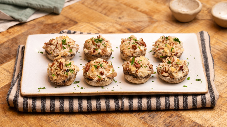 cream cheese stuffed mushrooms on serving platter