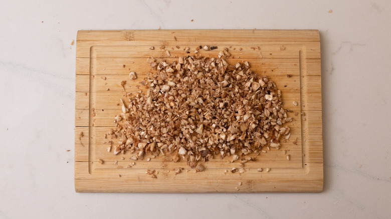 chopped mushroom stems on board