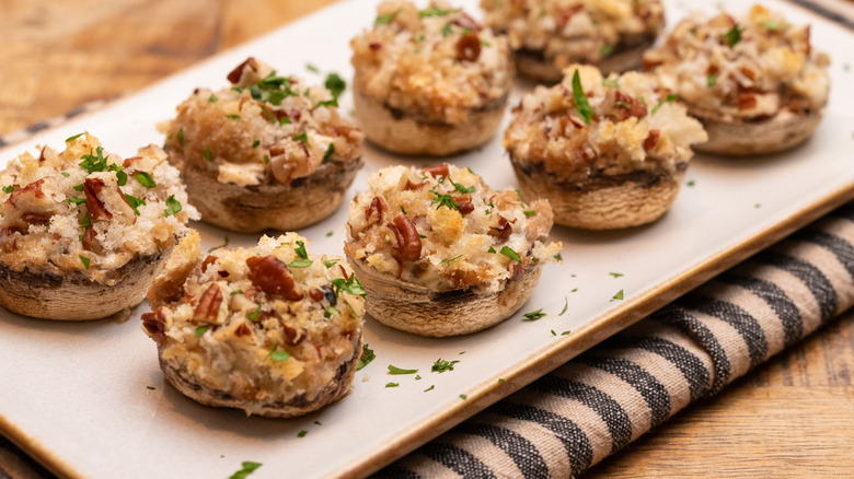 cream cheese stuffed mushrooms on serving platter