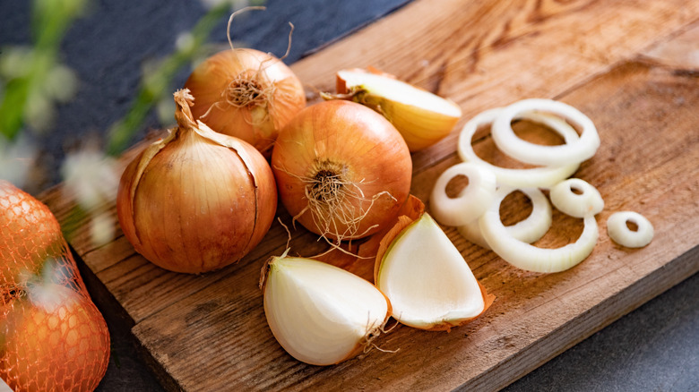 sliced onions on cutting board