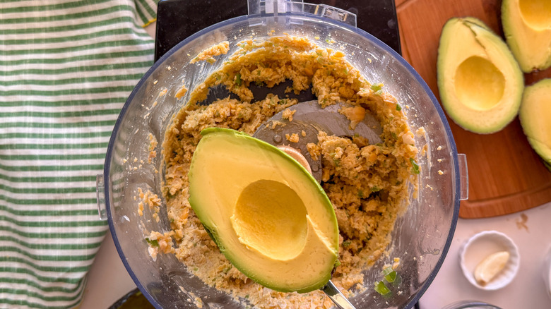 adding avocado to processor