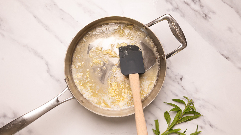 Cooking garlic in butter.