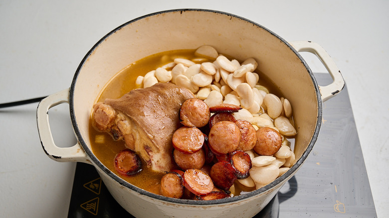 adding all ingredients to a pot