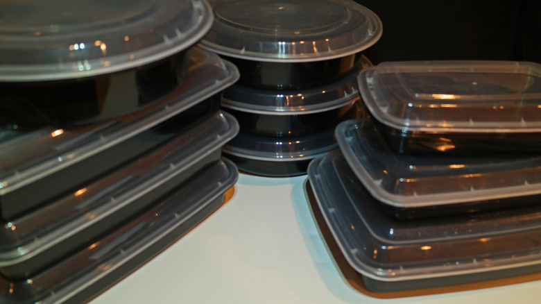 Different sizes of plastic takeout containers stacked together