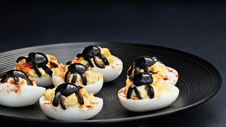 deviled eggs with olive spiders