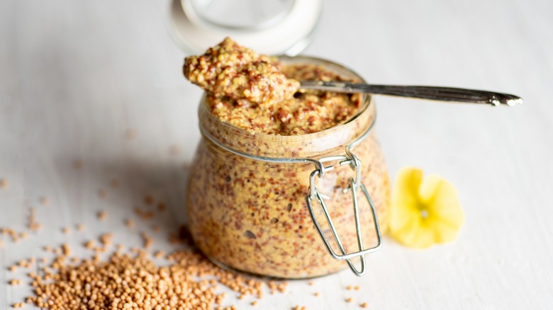 mustard in jar with spoon