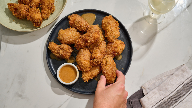 coconut chicken wings on a plate