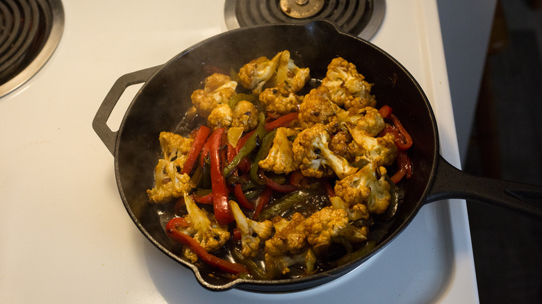 Chinese cauliflower cooking in pan