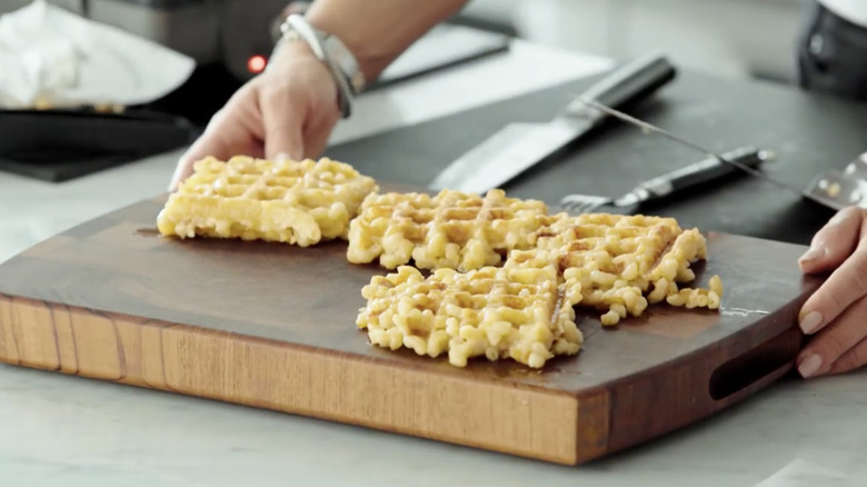 mac and cheese waffles on cutting board