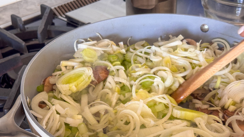stirring veggies in pan