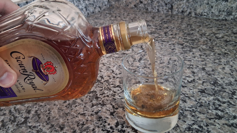 Crown Royal poured into glass on counter