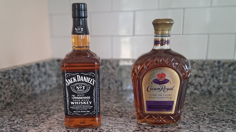 bottles of Crown Royal and Jack Daniel's on counter displayed side by side