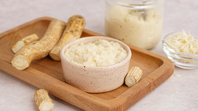 Bowl of horseradish with full root