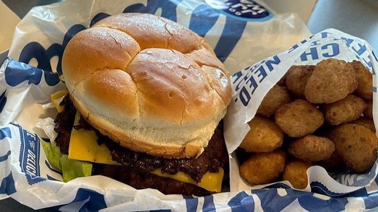 Culver's burger with potato side on paper