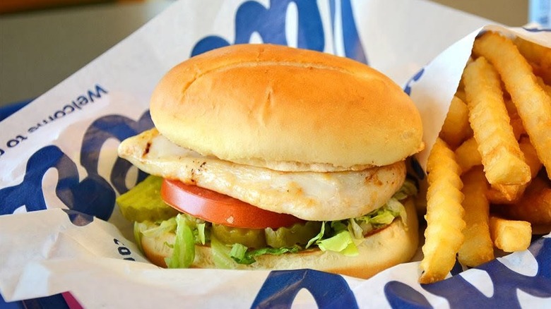 A grilled chicken sandwich and fries from Culver's in a basket
