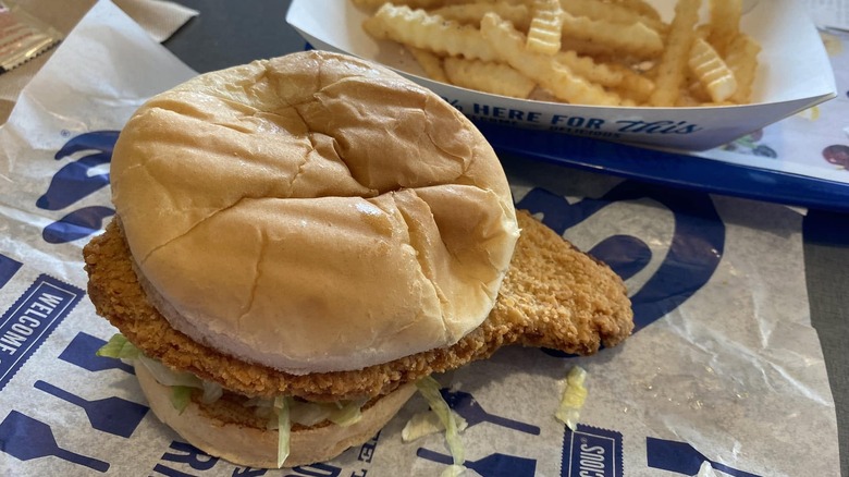 A pork loin sandwich and side of fries from Culver's on a tray