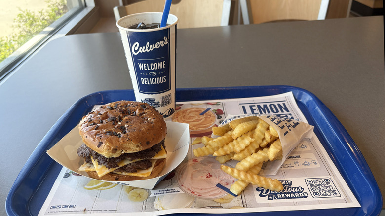 Blue tray on table with Culver's meal