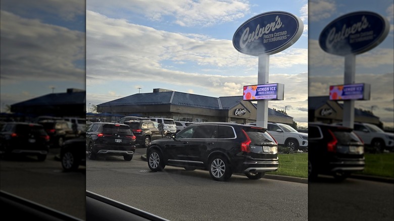 line of cars outside Culver's drive thru, mirrored image