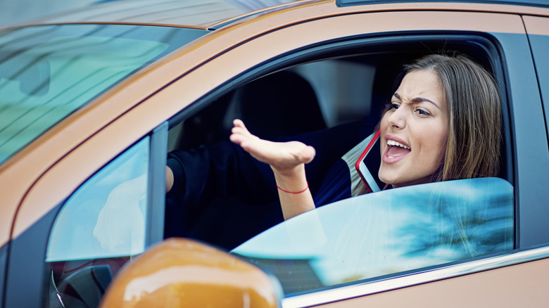 woman shouting out of car window