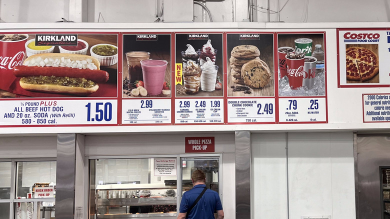 Person waiting at pizza pick up counter at Costco food court