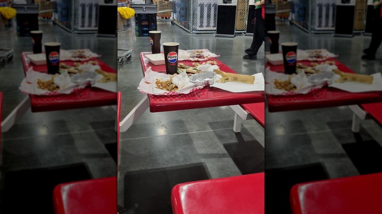 Mirrored image of dirty table in Costco food court