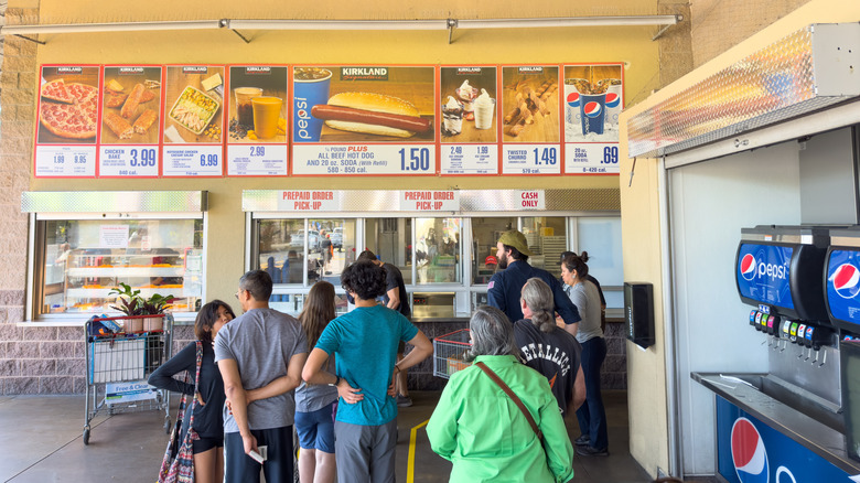 Costco Food Court window with people in line for pickup