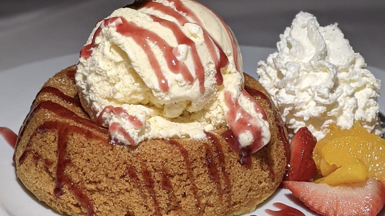 Close-up of butter cake with fruit and ice cream