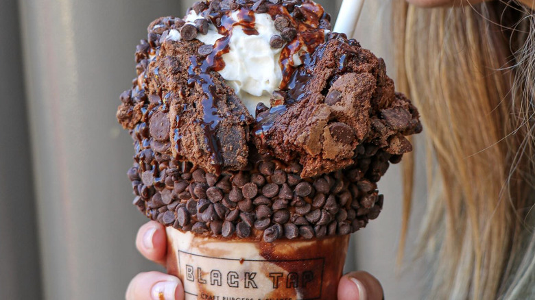 Milkshake topped with brownies and chocolate