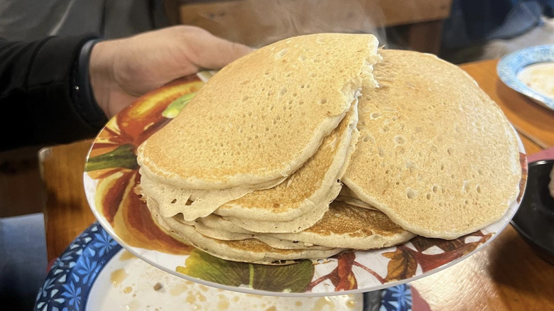 Stack of pancakes on a plate.